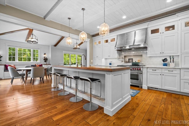 7S361 Arbor Dr, Naperville, IL 60540 - kitchen featuring an inviting chandelier, luxury range, wall chimney range hood, wood-type flooring, and beam ceiling
