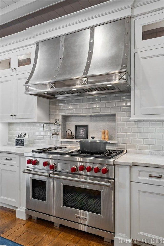7S361 Arbor Dr, Naperville, IL 60540 - kitchen with double oven range, white cabinetry, tasteful backsplash, and wall chimney exhaust hood