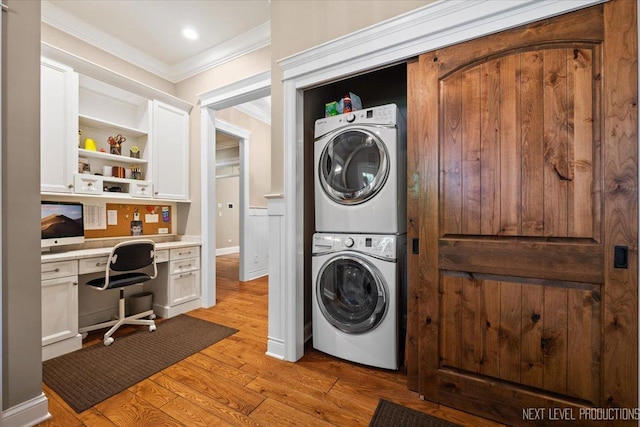 7S361 Arbor Dr, Naperville, IL 60540 - laundry room featuring stacked washer / dryer, crown molding, light wood finished floors, and laundry area