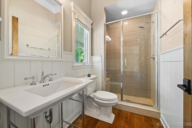 7S361 Arbor Dr, Naperville, IL 60540 - bathroom featuring toilet, a shower stall, wainscoting, and wood finished floors
