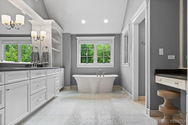 7S361 Arbor Dr, Naperville, IL 60540 - full bath with a freestanding bath, baseboards, vanity, and a healthy amount of sunlight
