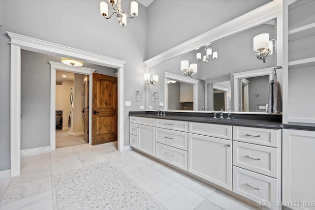 7S361 Arbor Dr, Naperville, IL 60540 - bathroom with a sink, double vanity, a notable chandelier, and baseboards