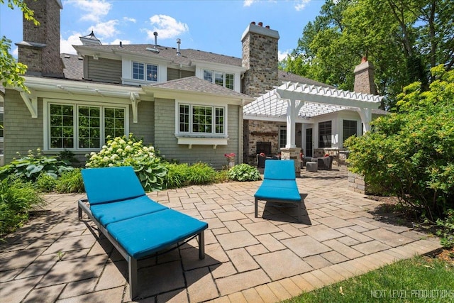 7S361 Arbor Dr, Naperville, IL 60540 - back of house featuring a patio, a pergola, and a chimney