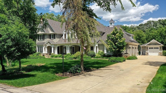 7S361 Arbor Dr, Naperville, IL 60540 - view of front facade with a chimney, a front yard, and a garage