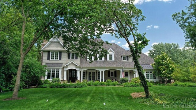 7S361 Arbor Dr, Naperville, IL 60540 - view of front of home featuring a standing seam roof, a front yard, and metal roof