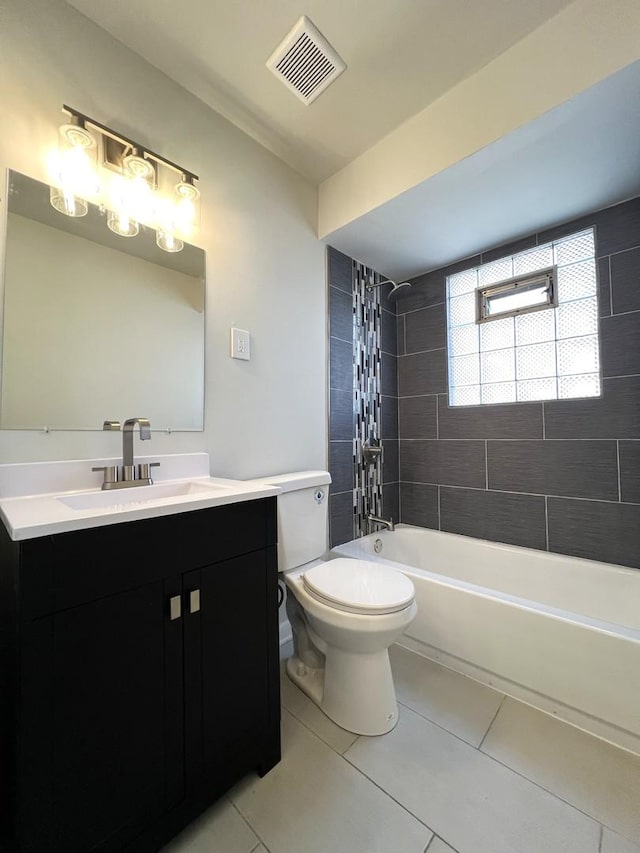 full bathroom with tile patterned floors, toilet, vanity, and  shower combination