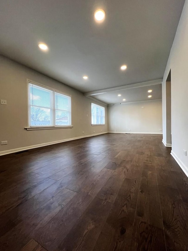unfurnished room featuring dark wood-style flooring, recessed lighting, and baseboards