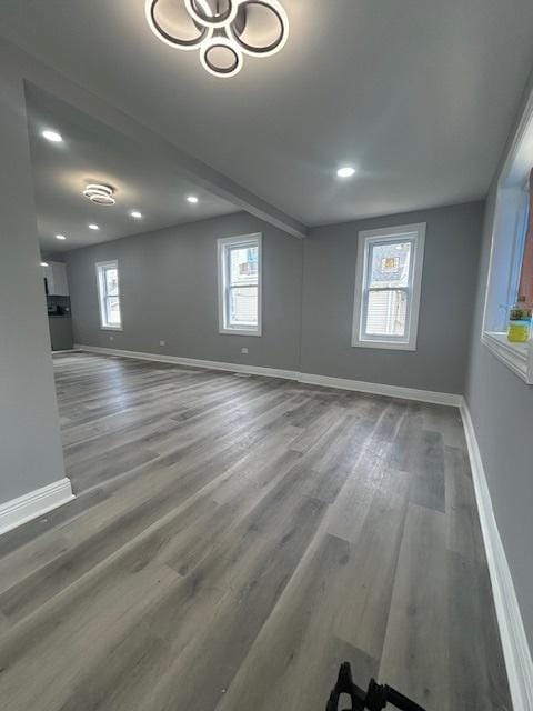 interior space with wood finished floors, recessed lighting, and baseboards