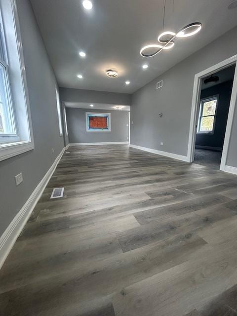 interior space featuring recessed lighting, visible vents, wood finished floors, and baseboards