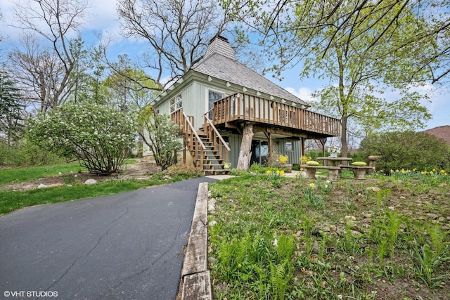23460W N Lakewood Ln, Lake Zurich, IL 60047 - rear view of house featuring stairs, a deck, and a chimney