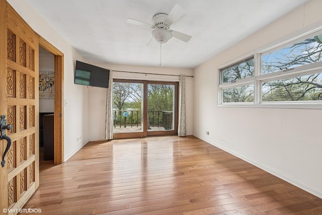 23460W N Lakewood Ln, Lake Zurich, IL 60047 - spare room with baseboards, a ceiling fan, and light wood-style floors