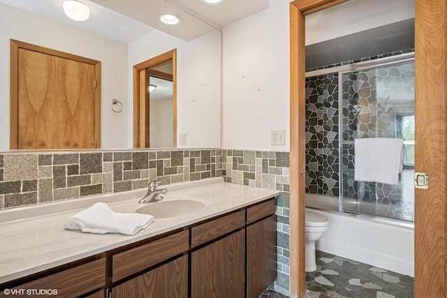 23460W N Lakewood Ln, Lake Zurich, IL 60047 - full bathroom with tile walls, toilet, bath / shower combo with glass door, and vanity