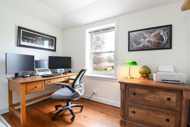 office with baseboards and wood finished floors