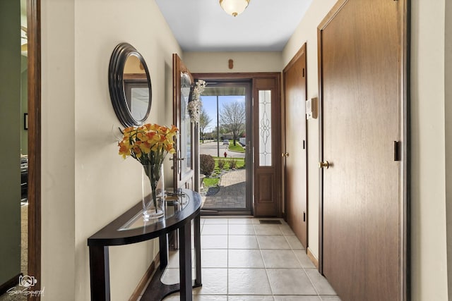 entryway featuring light tile patterned floors