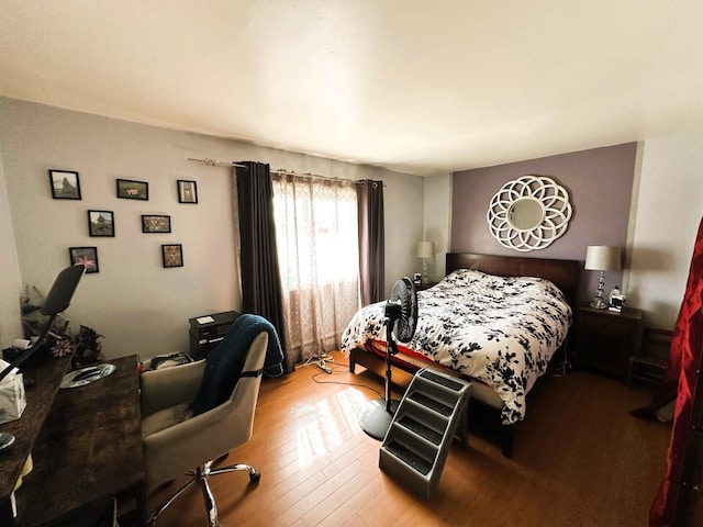 bedroom featuring wood finished floors