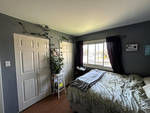 bedroom featuring dark wood finished floors