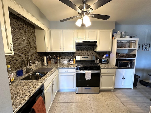 kitchen with stainless steel appliances, under cabinet range hood, a sink, decorative backsplash, and white cabinetry