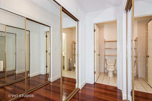 corridor featuring wood finished floors