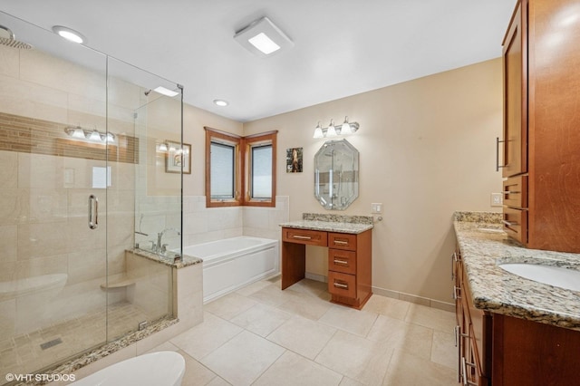 bathroom featuring a garden tub, tile patterned flooring, a shower stall, vanity, and baseboards