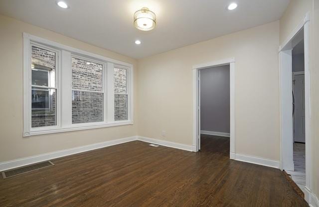 162 N La Crosse Ave, Chicago, IL 60644 - empty room with visible vents, recessed lighting, dark wood finished floors, and baseboards
