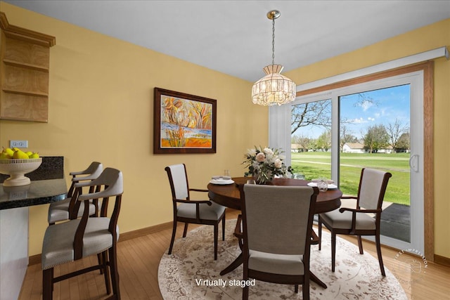 21600 W Larch Dr, Plainfield, IL 60544 - dining room with wood-type flooring, baseboards, and a notable chandelier