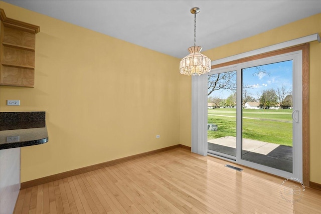 21600 W Larch Dr, Plainfield, IL 60544 - unfurnished dining area with baseboards, light wood finished floors, and visible vents