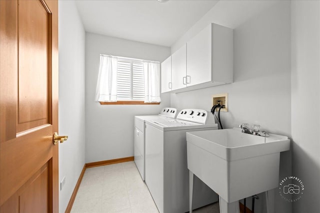 21600 W Larch Dr, Plainfield, IL 60544 - clothes washing area featuring light floors, independent washer and dryer, baseboards, a sink, and cabinet space