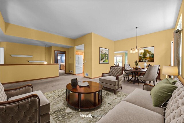 21600 W Larch Dr, Plainfield, IL 60544 - living area with baseboards, a chandelier, and carpet floors