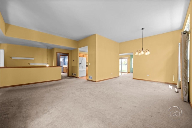 21600 W Larch Dr, Plainfield, IL 60544 - unfurnished living room with an inviting chandelier, baseboards, and carpet floors