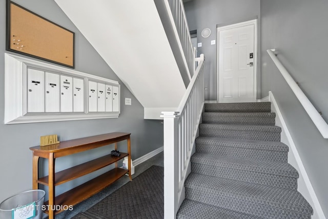 1935 Sherman Ave Unit 2N, Evanston, IL 60201 - staircase with carpet flooring, baseboards, mail area, and lofted ceiling