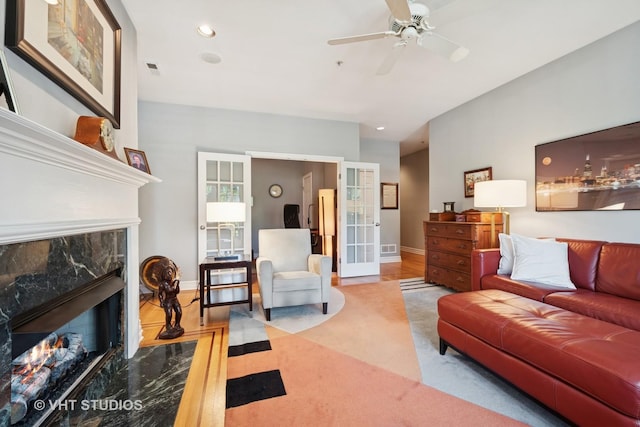 1935 Sherman Ave Unit 2N, Evanston, IL 60201 - carpeted living room with french doors, a fireplace, ceiling fan, recessed lighting, and baseboards