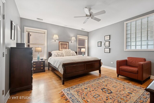 1935 Sherman Ave Unit 2N, Evanston, IL 60201 - bedroom featuring baseboards, light wood-type flooring, and a ceiling fan