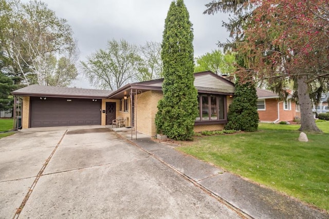ranch-style house featuring brick siding, an attached garage, and a front yard