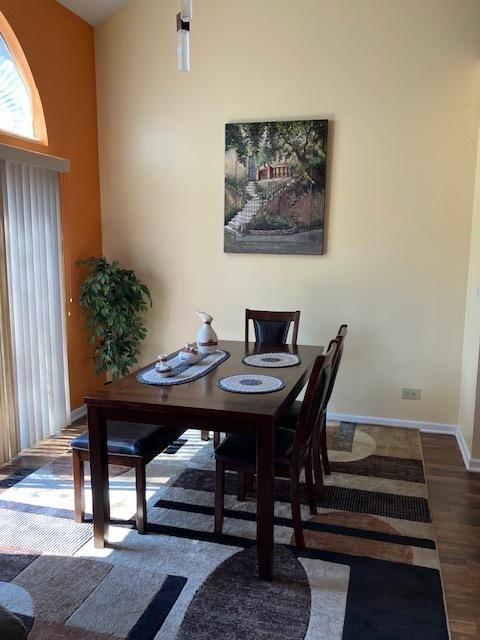 1032 Rockport Dr Unit 1032, Carol Stream, IL 60188 - dining area with baseboards and wood finished floors