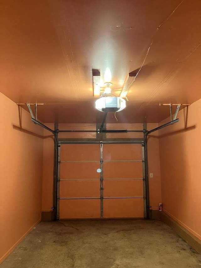 1032 Rockport Dr Unit 1032, Carol Stream, IL 60188 - garage featuring baseboards and a garage door opener