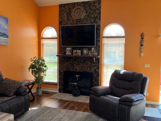 1032 Rockport Dr Unit 1032, Carol Stream, IL 60188 - living area featuring a large fireplace, wood finished floors, and baseboards