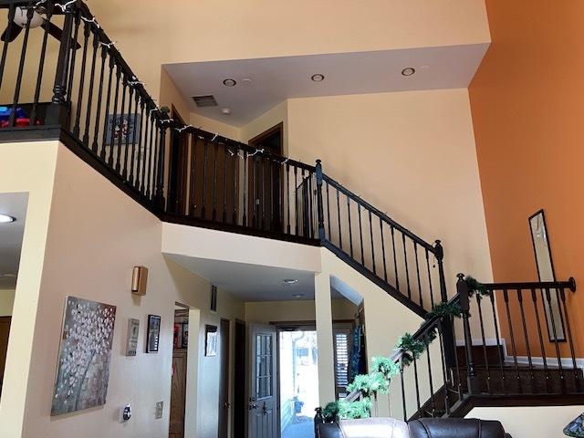 1032 Rockport Dr Unit 1032, Carol Stream, IL 60188 - staircase featuring a high ceiling, visible vents, and recessed lighting