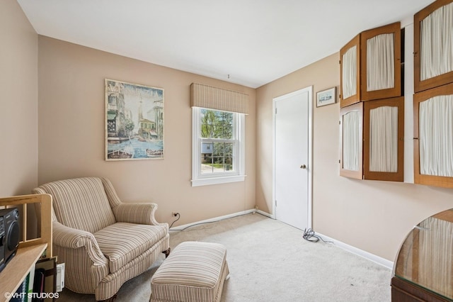 sitting room with carpet flooring and baseboards