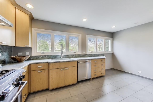 kitchen with recessed lighting, a sink, appliances with stainless steel finishes, and light tile patterned floors