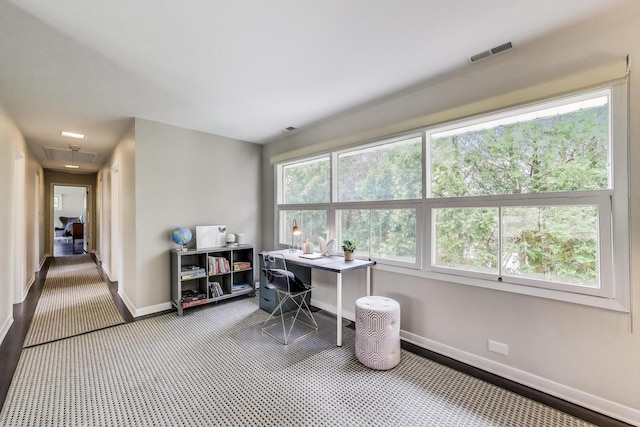 office area with baseboards, carpet, attic access, and visible vents
