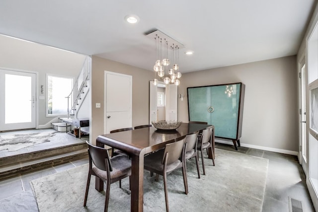 dining room with visible vents, baseboards, stairway, recessed lighting, and a chandelier