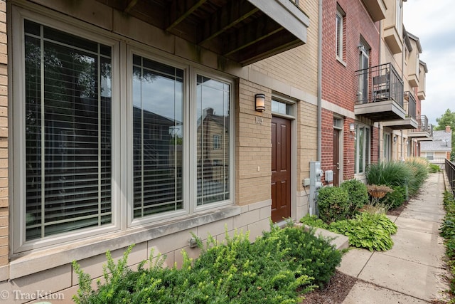 property entrance with brick siding