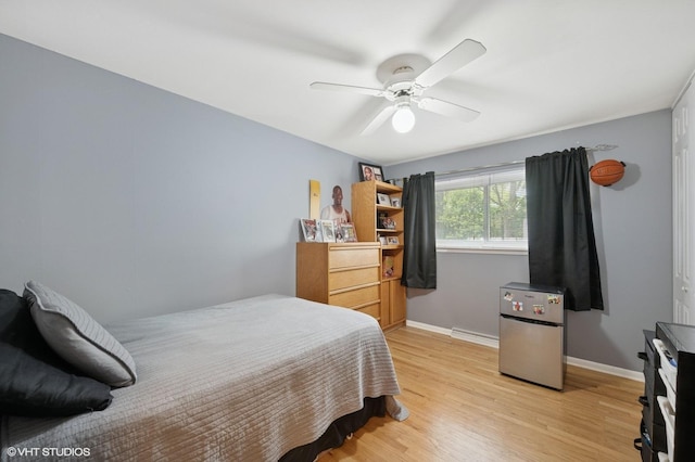 310 N Lytle Dr, Palatine, IL 60074 - bedroom featuring light wood-type flooring, baseboards, and ceiling fan