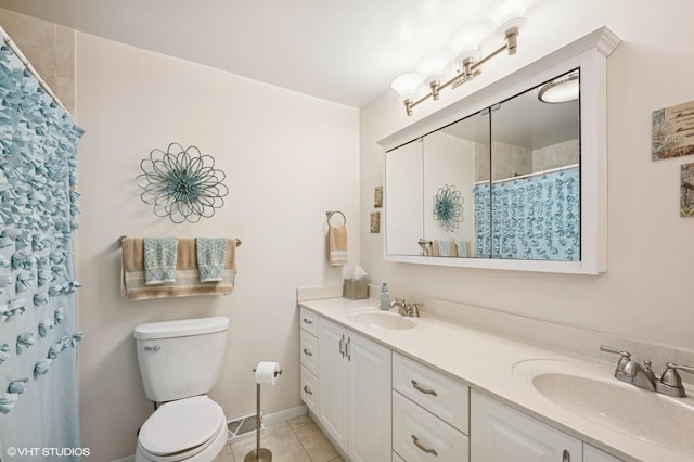 310 N Lytle Dr, Palatine, IL 60074 - full bathroom with tile patterned floors, double vanity, toilet, and curtained shower