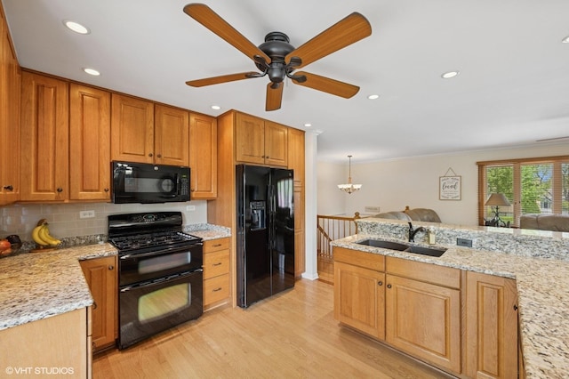 310 N Lytle Dr, Palatine, IL 60074 - kitchen featuring black appliances, a sink, light wood-style floors, tasteful backsplash, and light stone countertops