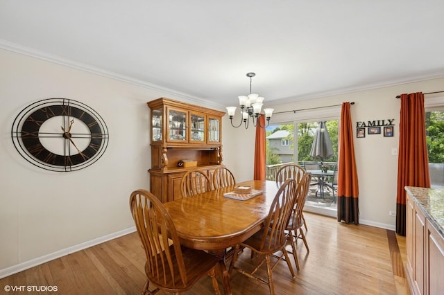 310 N Lytle Dr, Palatine, IL 60074 - dining space featuring a chandelier, baseboards, light wood finished floors, and crown molding
