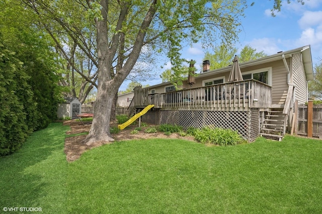 310 N Lytle Dr, Palatine, IL 60074 - view of yard with stairs, a wooden deck, a shed, and an outbuilding