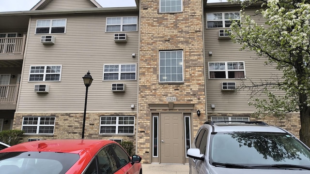 1524 W Sand Bar Ct Unit 2A, Round Lake, IL 60073 - exterior space with a wall mounted AC