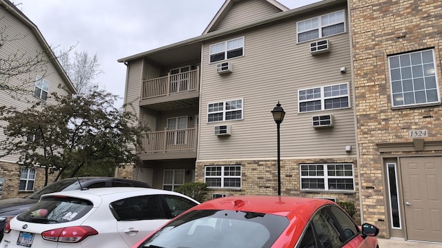 1524 W Sand Bar Ct Unit 2A, Round Lake, IL 60073 - view of property featuring a wall mounted air conditioner