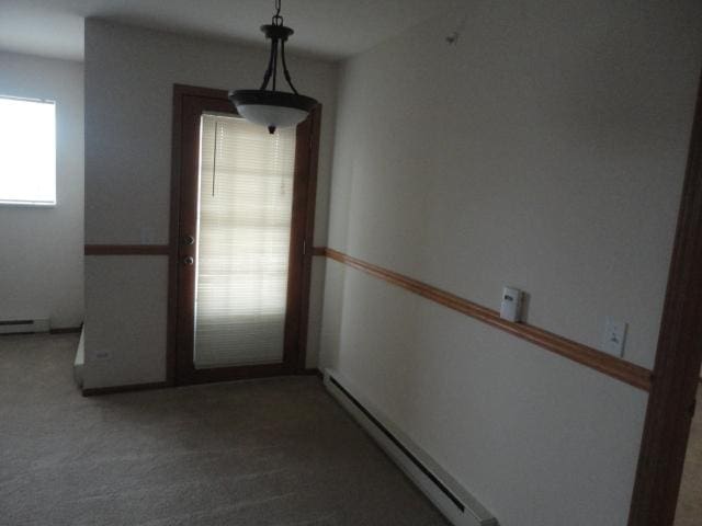 1524 W Sand Bar Ct Unit 2A, Round Lake, IL 60073 - unfurnished room with carpet floors and a baseboard radiator